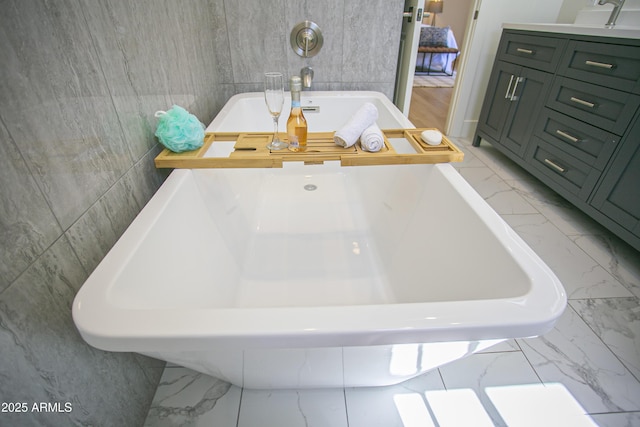 6608 E Ranch Rd, Cave Creek, AZ 85331 - bathroom with marble look tiles and a soaking tub