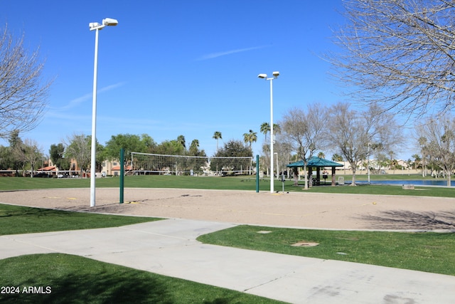 surrounding community featuring a gazebo, volleyball court, and a lawn