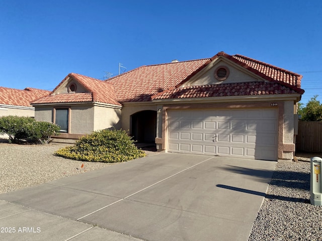 1249 E Commerce Ave, Gilbert, AZ 85234 - view of front of home featuring stucco siding, a garage, concrete driveway, and a tiled roof