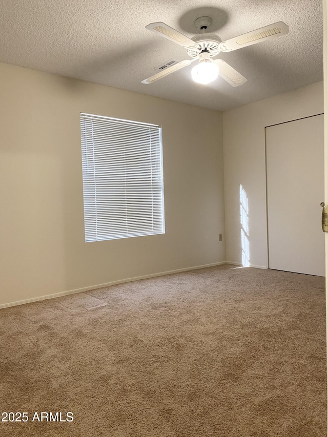 1249 E Commerce Ave, Gilbert, AZ 85234 - carpeted spare room with a textured ceiling and ceiling fan