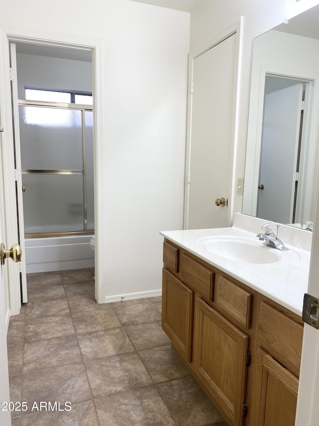 1249 E Commerce Ave, Gilbert, AZ 85234 - bathroom with vanity and shower / bath combination with glass door