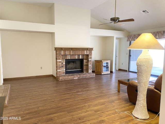 1249 E Commerce Ave, Gilbert, AZ 85234 - living room with a ceiling fan, wood finished floors, a fireplace, and high vaulted ceiling