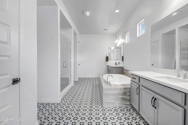 32083 N 126th Ave, Peoria, AZ 85383 - full bathroom with a stall shower, a garden tub, two vanities, baseboards, and recessed lighting