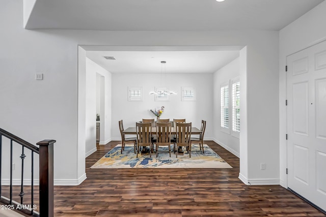 32083 N 126th Ave, Peoria, AZ 85383 - dining space featuring dark wood-type flooring, baseboards, and a chandelier