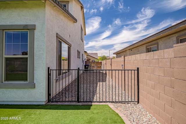 32083 N 126th Ave, Peoria, AZ 85383 - view of property exterior featuring stucco siding, fence, and a gate