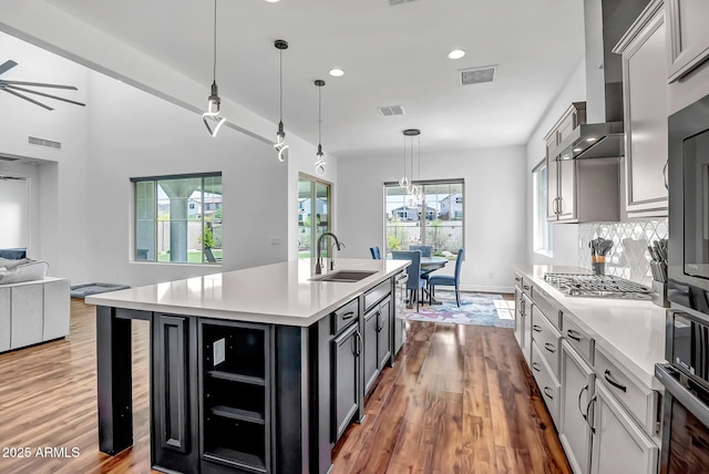 32083 N 126th Ave, Peoria, AZ 85383 - kitchen featuring a sink, open floor plan, light wood finished floors, recessed lighting, and light countertops
