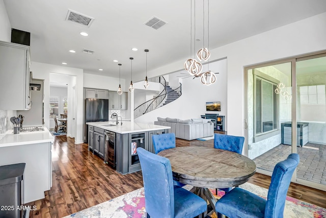 32083 N 126th Ave, Peoria, AZ 85383 - dining space with stairway, dark wood-style flooring, and recessed lighting