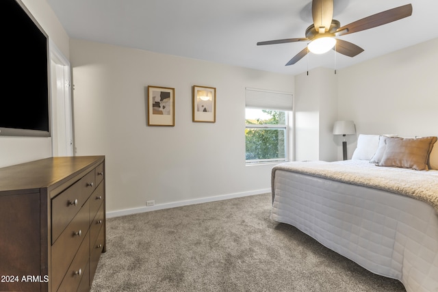 bedroom with ceiling fan and light colored carpet