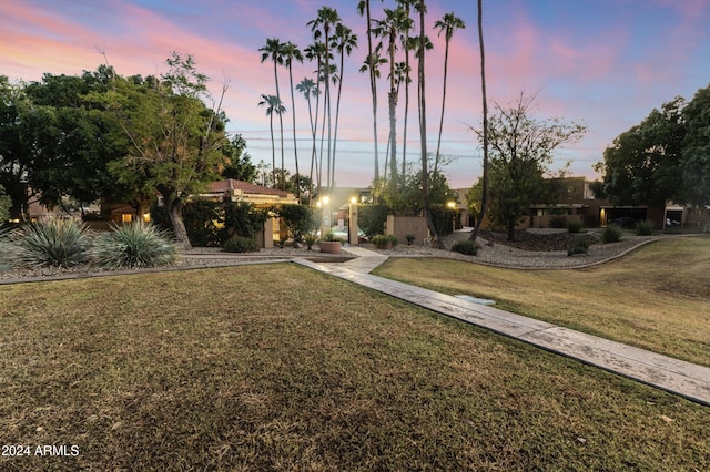 view of property's community with a lawn