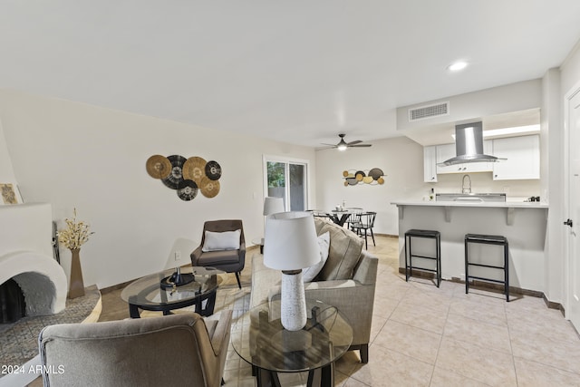 tiled living room with ceiling fan