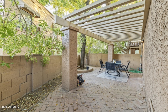 view of patio featuring a pergola