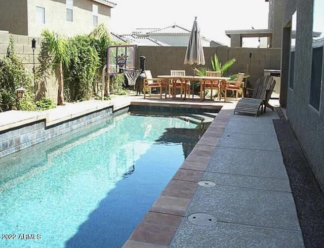 view of pool featuring a patio