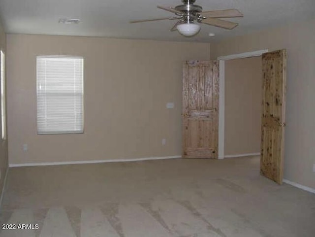 unfurnished room featuring ceiling fan