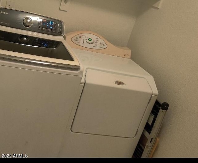 laundry area with washer and dryer