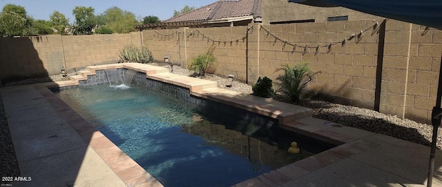 view of pool with pool water feature