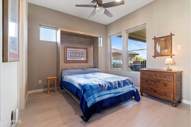 bedroom with ceiling fan and light hardwood / wood-style flooring