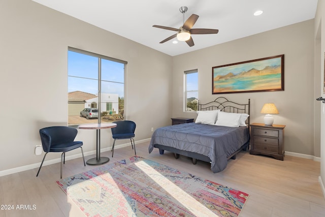 bedroom featuring ceiling fan and light hardwood / wood-style floors