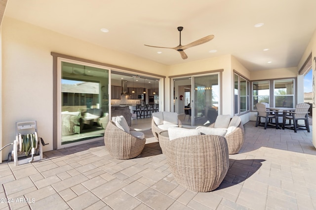 view of patio featuring outdoor lounge area and ceiling fan