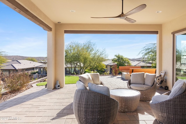 view of patio featuring ceiling fan