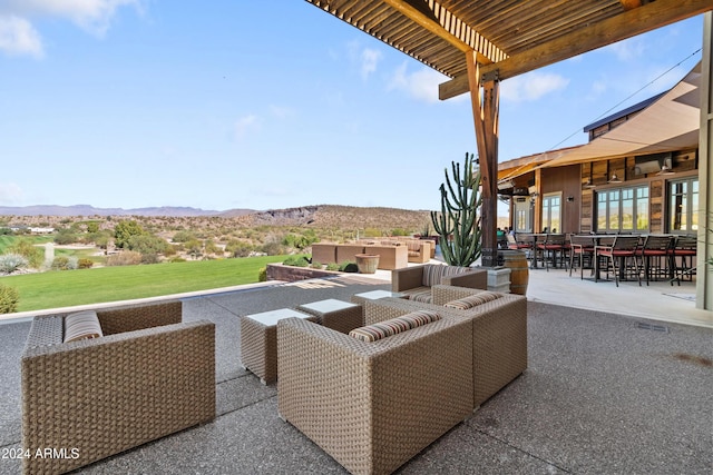 view of patio with a pergola, a mountain view, and an outdoor hangout area