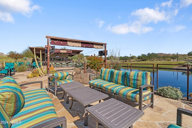 view of patio / terrace with a water view and an outdoor hangout area