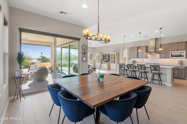 dining space featuring a notable chandelier