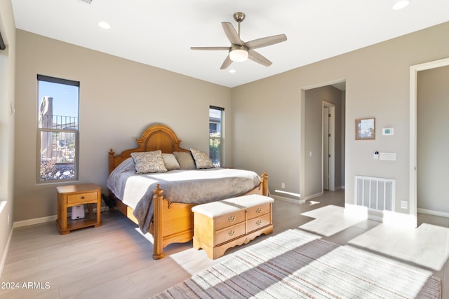 bedroom featuring light wood-type flooring and ceiling fan