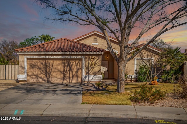 mediterranean / spanish-style home featuring a garage