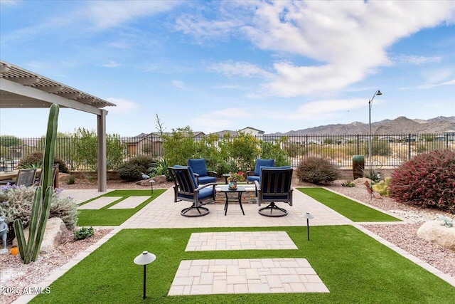 view of patio with a pergola and a mountain view