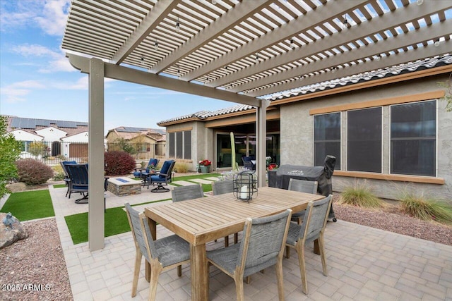 view of patio / terrace featuring an outdoor fire pit and a pergola