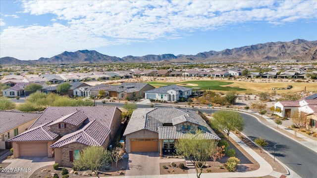 birds eye view of property with a mountain view