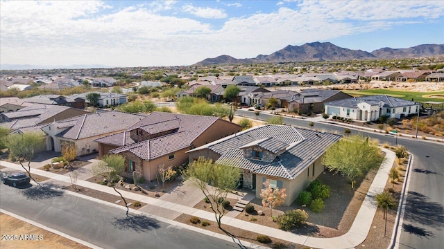 birds eye view of property featuring a mountain view