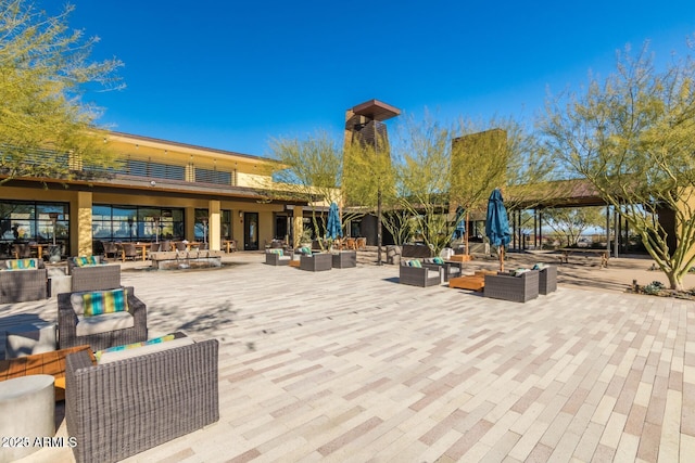 surrounding community with an outdoor living space and a patio