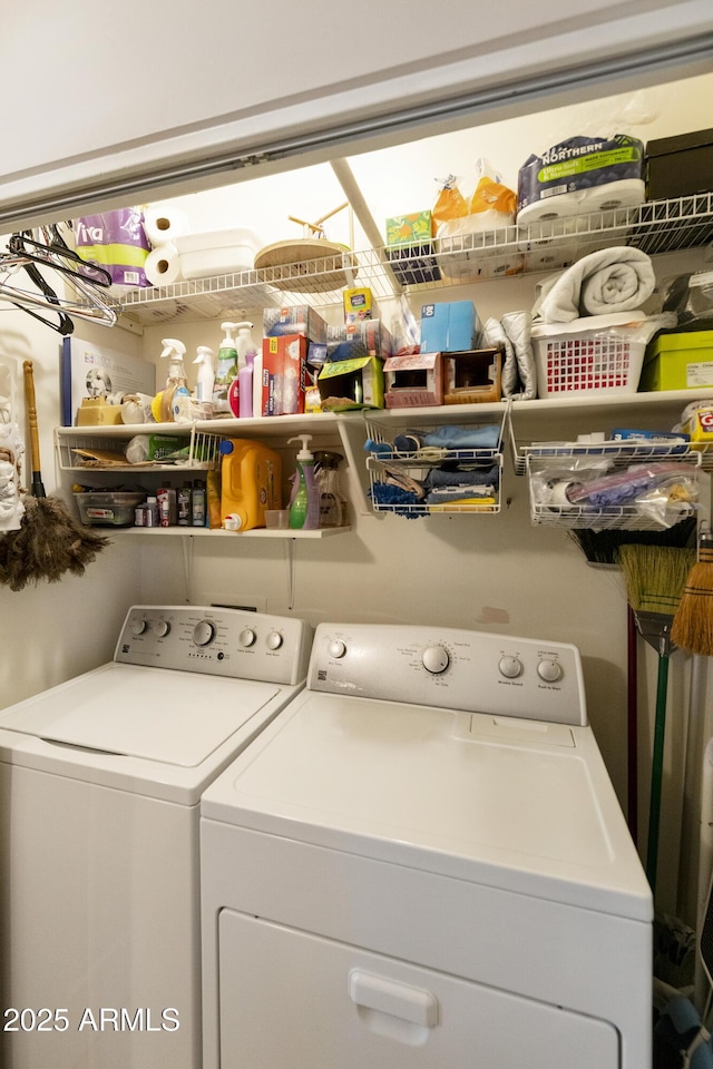 laundry room with washing machine and clothes dryer