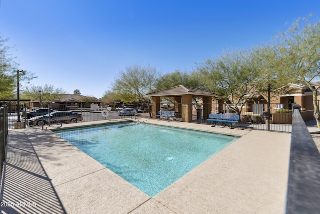 view of swimming pool featuring a gazebo and a patio area