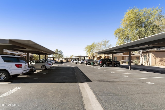 view of parking / parking lot featuring a carport