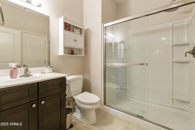 bathroom featuring walk in shower, tile patterned floors, toilet, and vanity