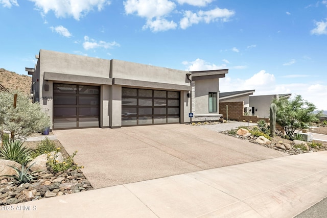 14507 N Valencia Dr, Fountain Hills, AZ 85268 - view of front of home featuring a garage, stucco siding, and concrete driveway