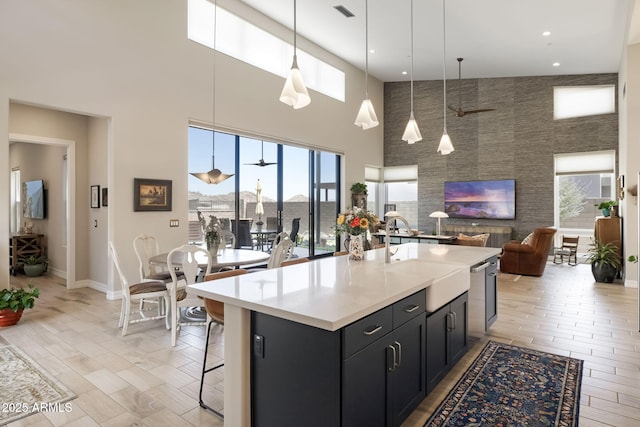 14507 N Valencia Dr, Fountain Hills, AZ 85268 - kitchen with a sink, healthy amount of natural light, open floor plan, baseboards, and a high ceiling