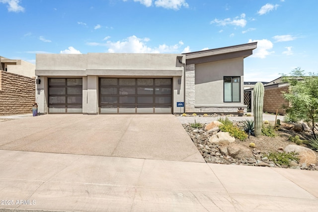 14507 N Valencia Dr, Fountain Hills, AZ 85268 - view of front of property with stucco siding, driveway, a garage, and stone siding