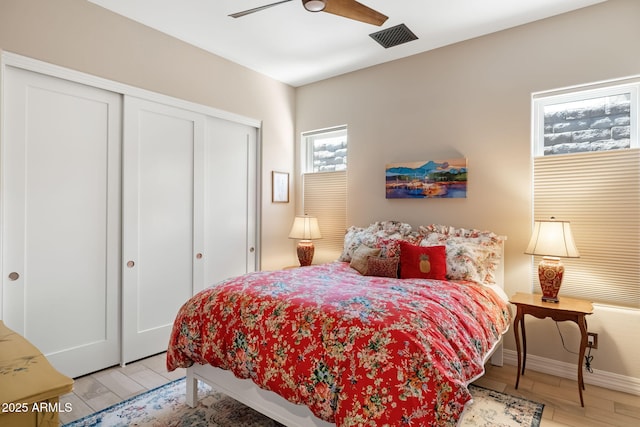 14507 N Valencia Dr, Fountain Hills, AZ 85268 - bedroom with a closet, wood finished floors, baseboards, and a ceiling fan