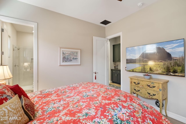 14507 N Valencia Dr, Fountain Hills, AZ 85268 - bedroom with connected bathroom and baseboards