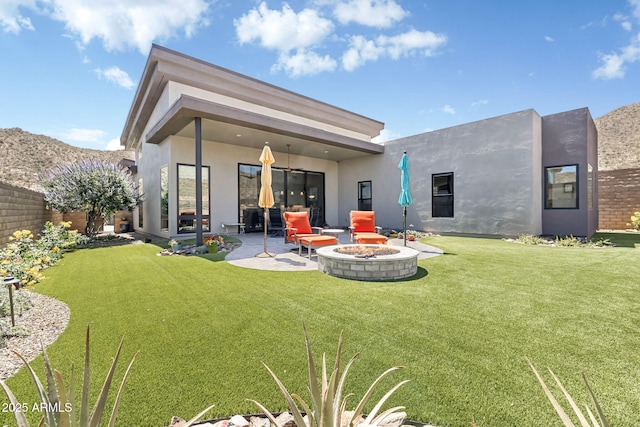 14507 N Valencia Dr, Fountain Hills, AZ 85268 - back of property with a fire pit, stucco siding, and a patio area