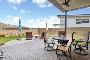 14507 N Valencia Dr, Fountain Hills, AZ 85268 - fenced backyard with outdoor dining area, a patio area, and ceiling fan