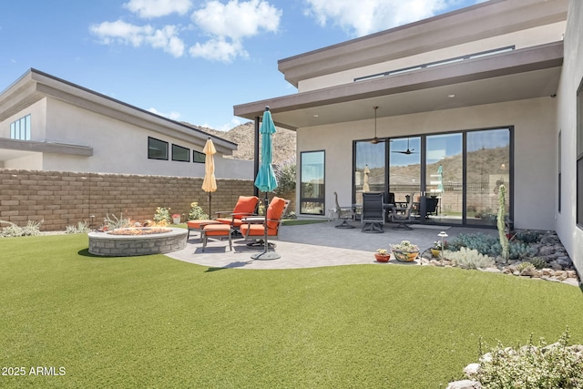 14507 N Valencia Dr, Fountain Hills, AZ 85268 - rear view of property with an outdoor fire pit, stucco siding, and a patio