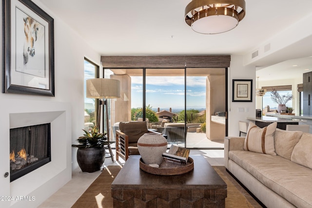 living room featuring a wall of windows