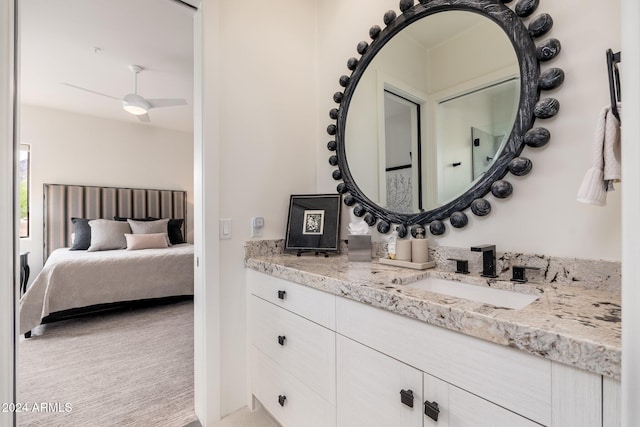 bathroom with ceiling fan and vanity