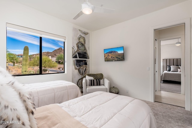 bedroom featuring ceiling fan and carpet flooring