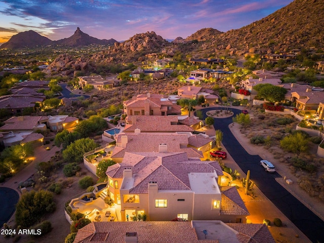 aerial view at dusk with a mountain view