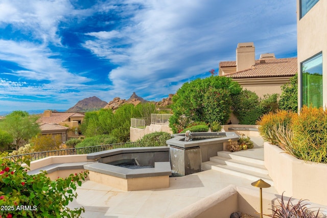 view of patio / terrace with a mountain view